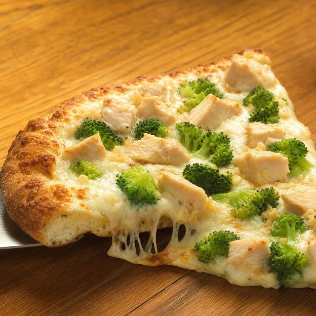 Chicken Scampi Pizza Slice.